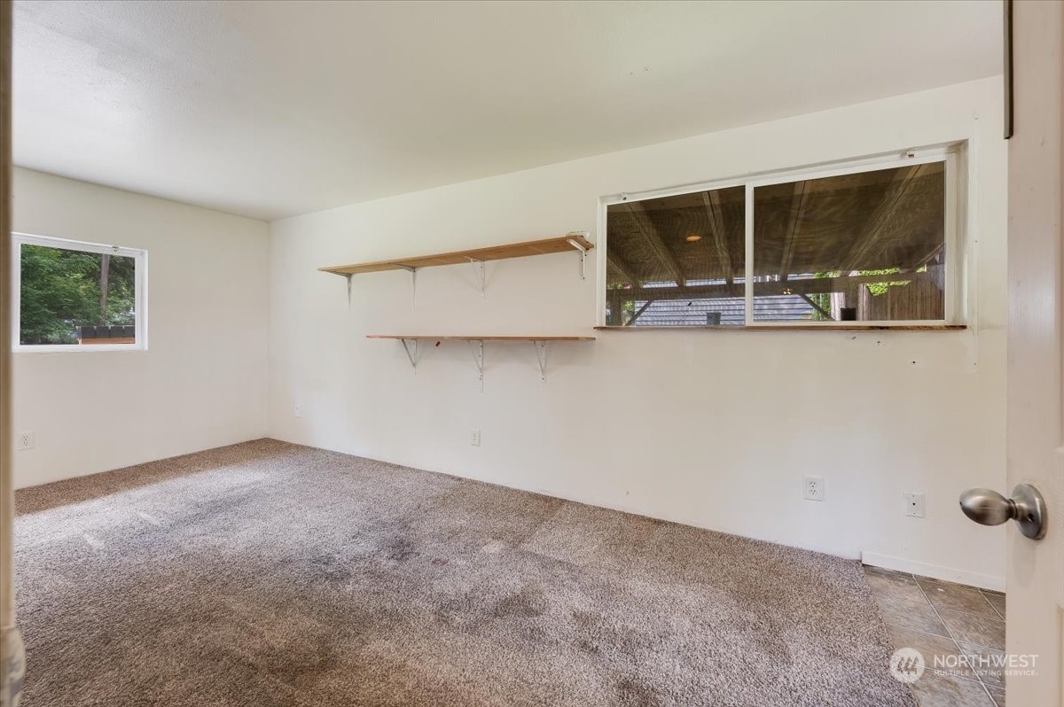 107 231st Street Southeast Bothell, WA 98021 - Photo 17 of 39 an empty room with a large window and mirror