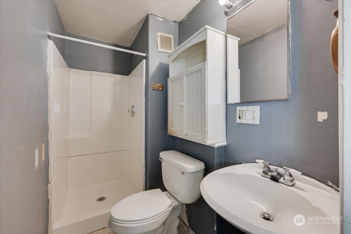 107 231st Street Southeast Bothell, WA 98021 - Photo 18 of 39 a bathroom with a sink toilet and shower