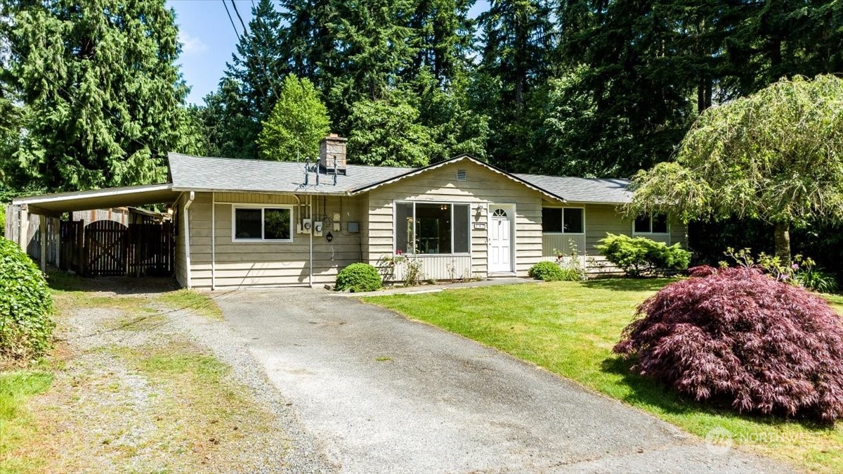 107 231st Street Southeast Bothell, WA 98021 - Photo 2 of 39 a front view of a house with a garden