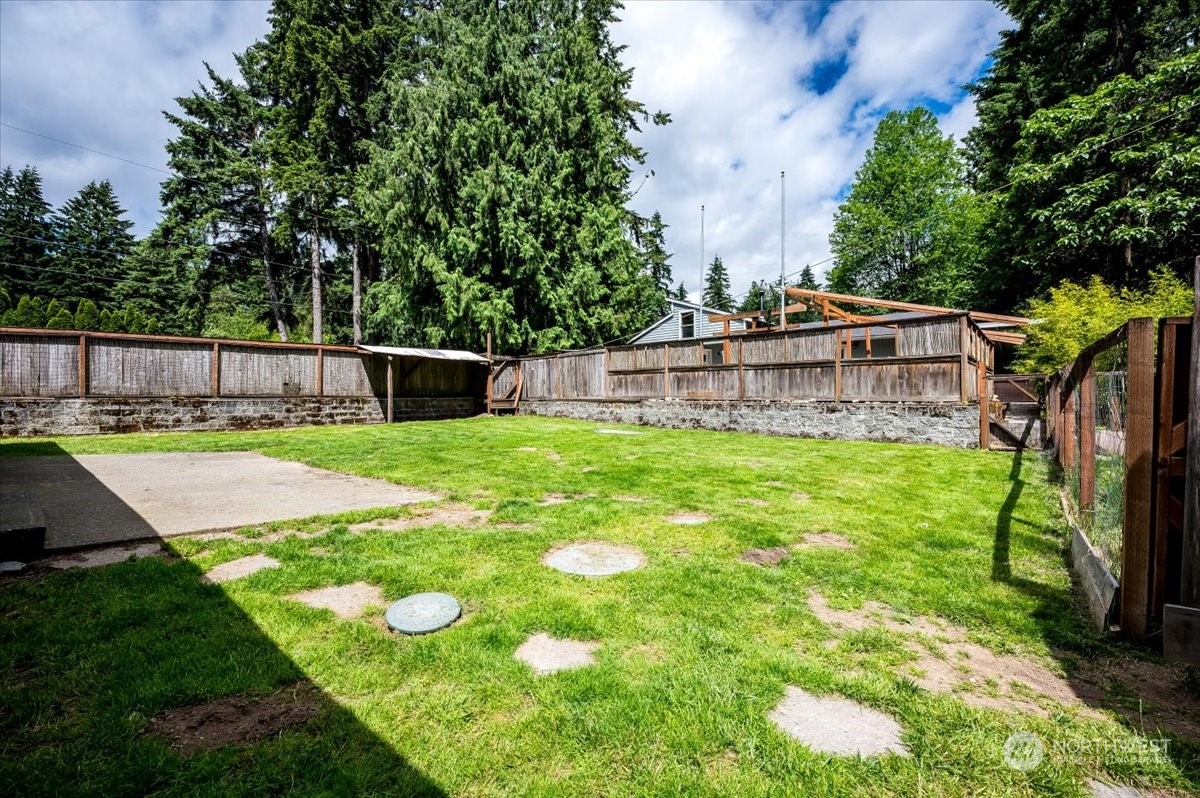 107 231st Street Southeast Bothell, WA 98021 - Photo 23 of 39 a view of a backyard with swimming pool
