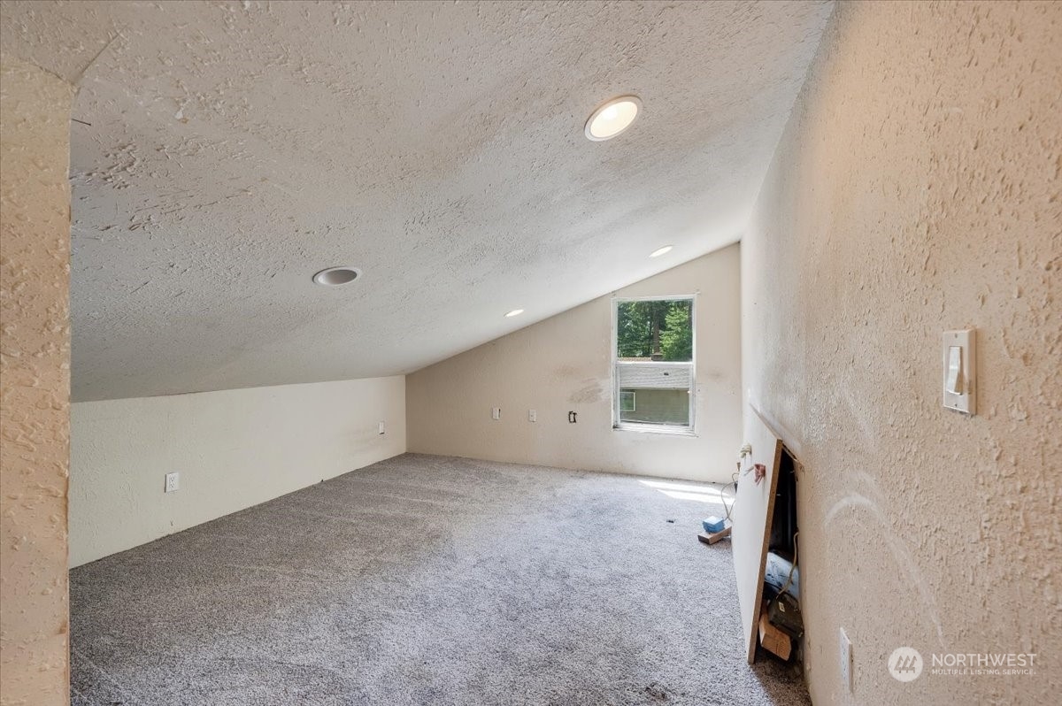 107 231st Street Southeast Bothell, WA 98021 - Photo 28 of 39 a view of a livingroom with an empty space and a window