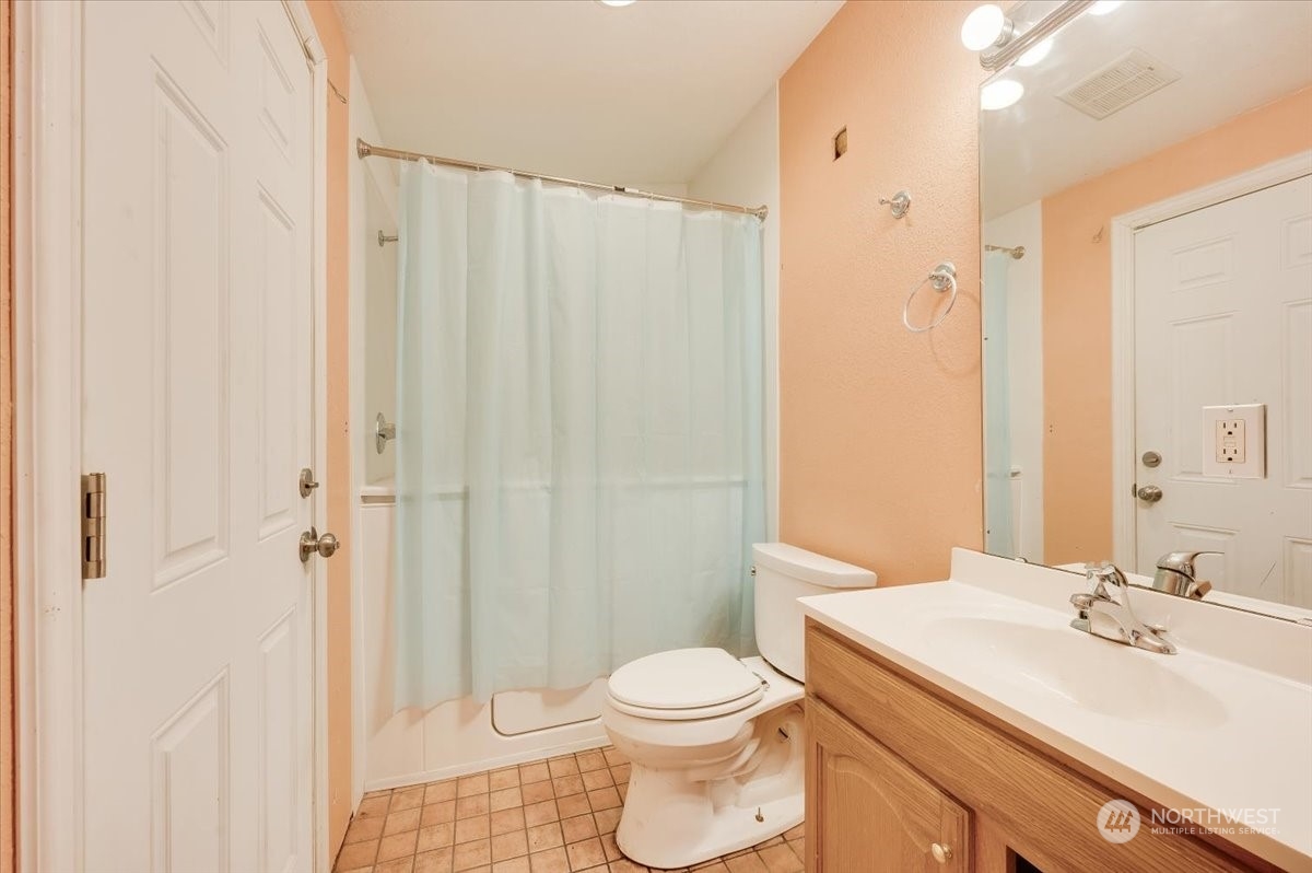 107 231st Street Southeast Bothell, WA 98021 - Photo 29 of 39 a bathroom with a sink a toilet and shower