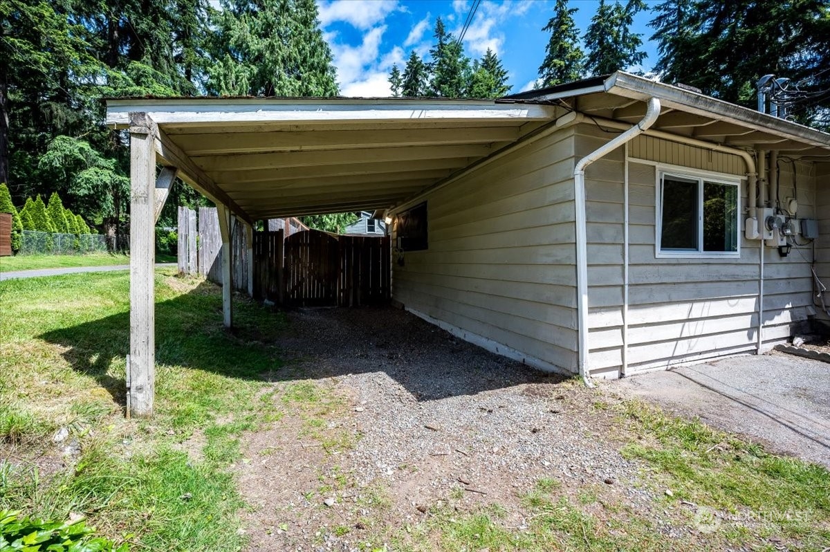107 231st Street Southeast Bothell, WA 98021 - Photo 4 of 39 a view of a house with a yard chairs and iron fence