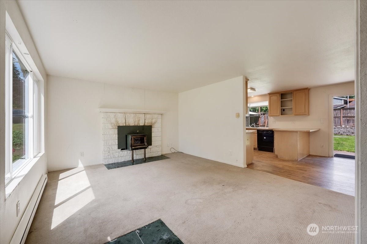 107 231st Street Southeast Bothell, WA 98021 - Photo 6 of 39 a view of a livingroom with a kitchen and a window