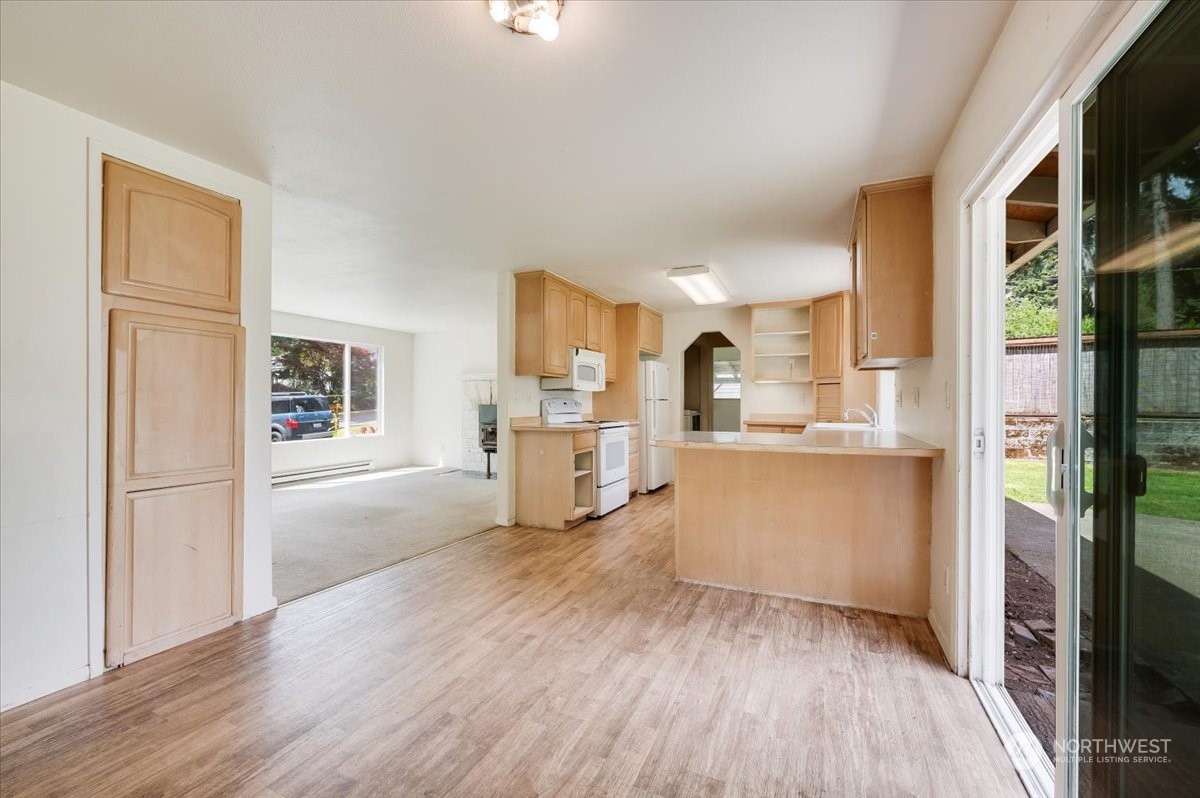 107 231st Street Southeast Bothell, WA 98021 - Photo 10 of 39 a view of kitchen with wooden floor