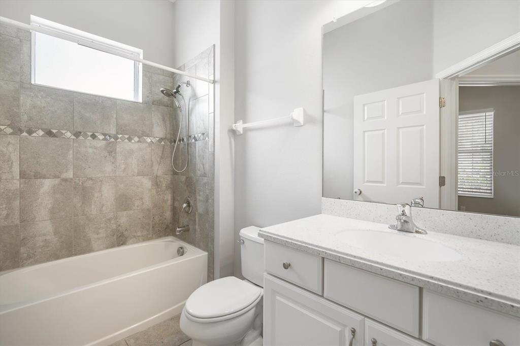 6523 Watson Road Riverview, FL 33578 - Photo 11 of 32 a bathroom with a sink a toilet and a bathtub