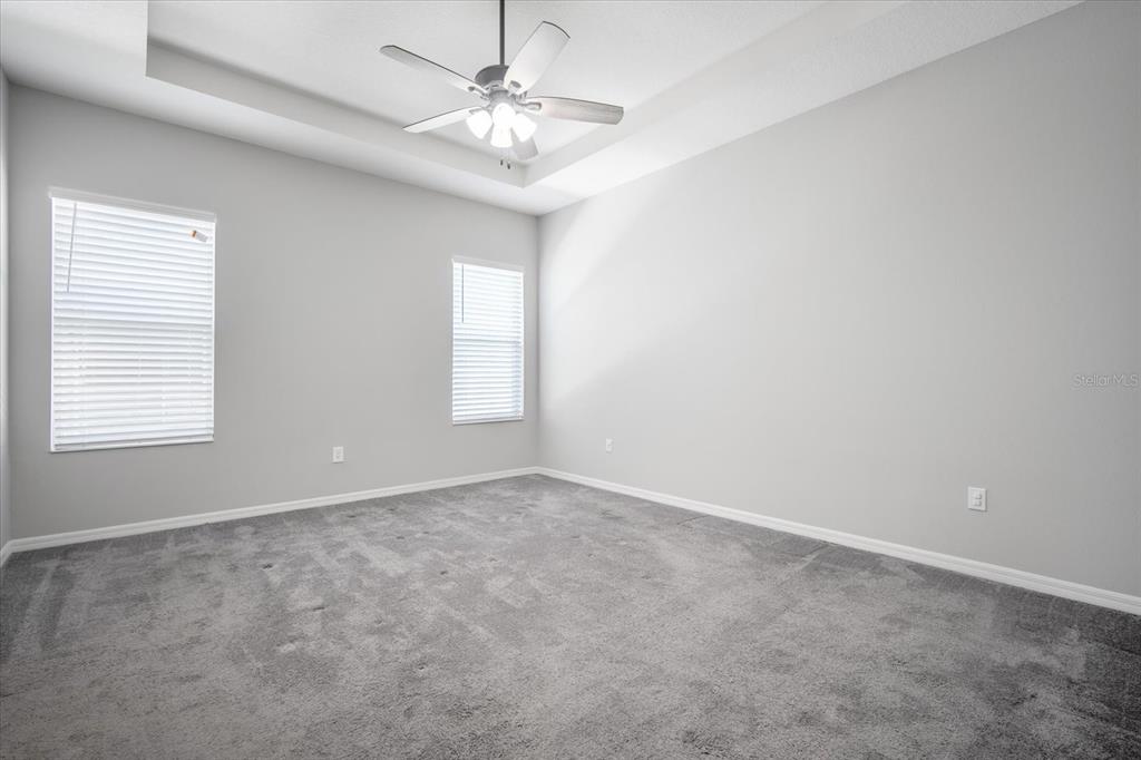 6523 Watson Road Riverview, FL 33578 - Photo 15 of 32 an empty room with windows and fan