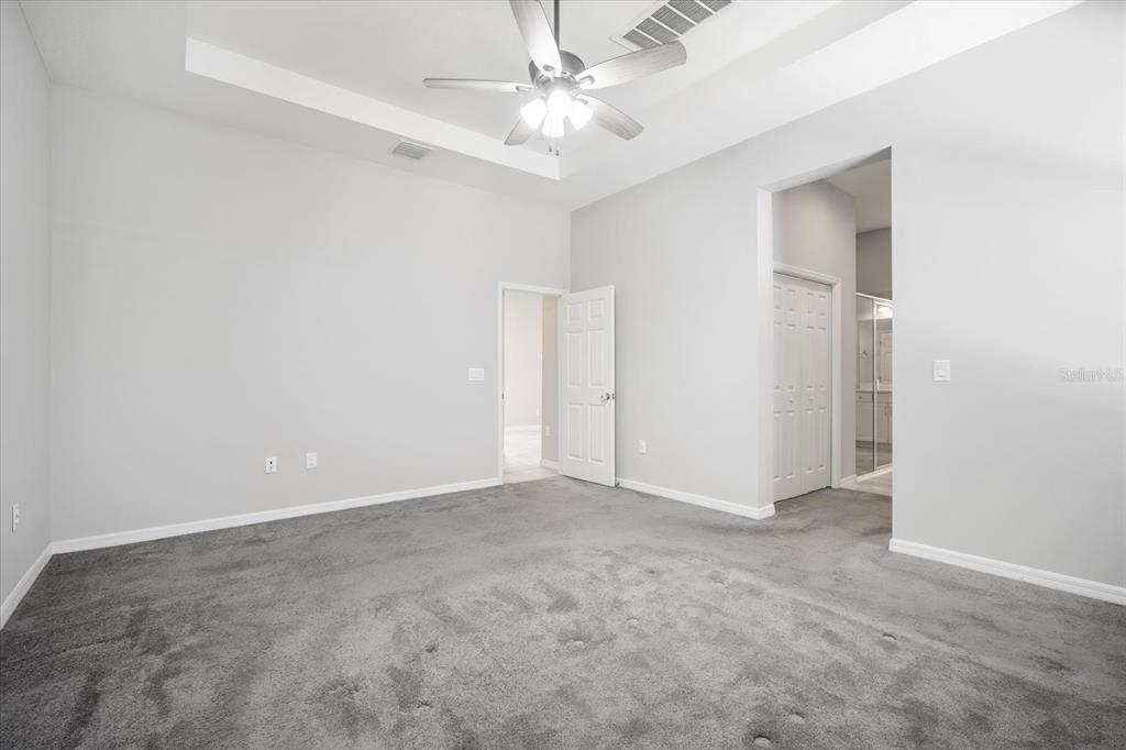 6523 Watson Road Riverview, FL 33578 - Photo 16 of 32 an empty room with fan and entryway