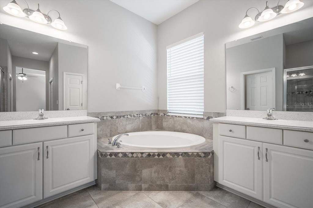 6523 Watson Road Riverview, FL 33578 - Photo 19 of 32 a bathroom with a sink toilet and mirror