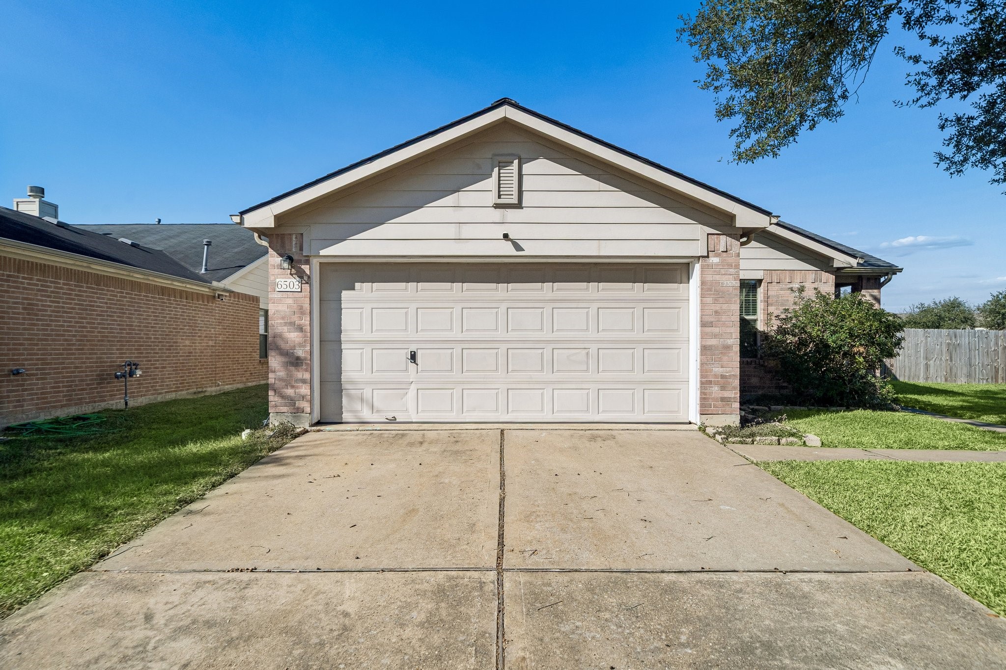 a front view of a house with a garage