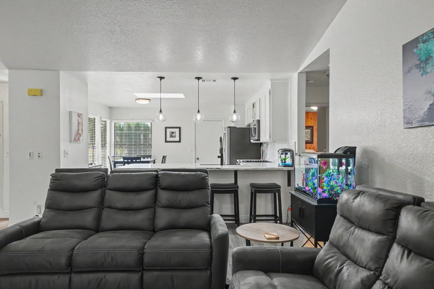67 St Andrews Road Valley Springs, CA 95252 - Photo 11 of 58 a living room with furniture and a large window