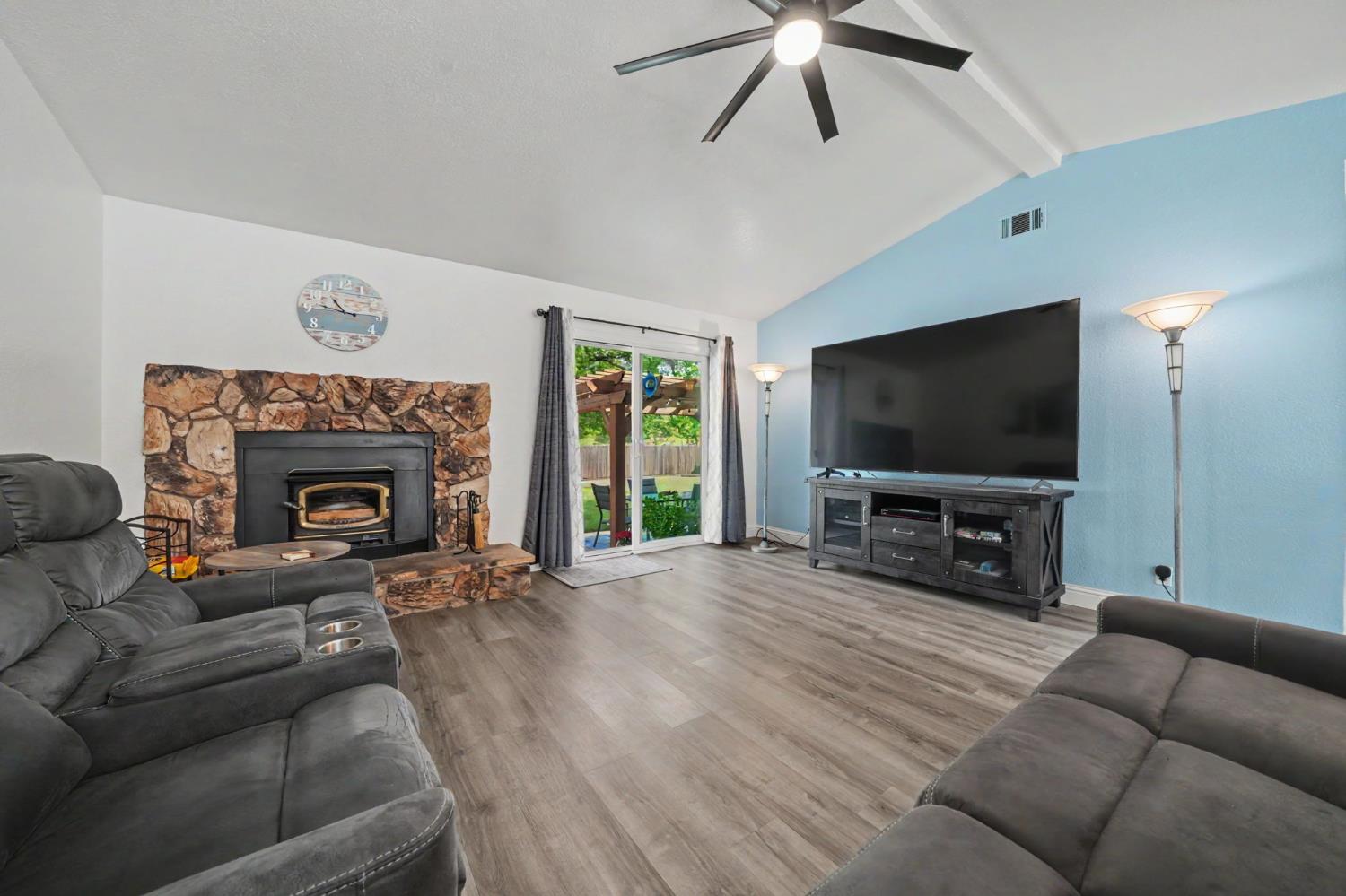 67 St Andrews Road Valley Springs, CA 95252 - Photo 14 of 58 a living room with furniture and a flat screen tv