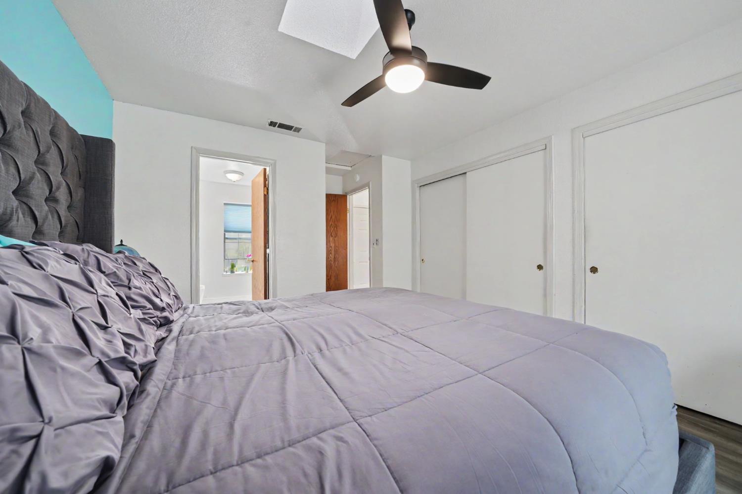 67 St Andrews Road Valley Springs, CA 95252 - Photo 26 of 58 a spacious bedroom with a bed and a ceiling fan