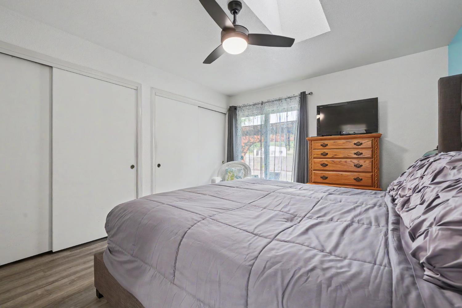 67 St Andrews Road Valley Springs, CA 95252 - Photo 27 of 58 a bedroom with a bed and a flat tv screen on a dresser