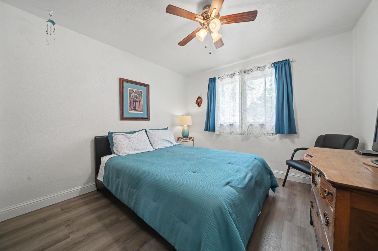 67 St Andrews Road Valley Springs, CA 95252 - Photo 30 of 58 a living room with a bed furniture and a window