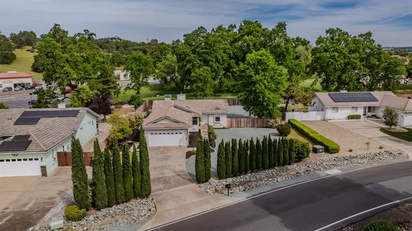 a aerial view of a house with a yard