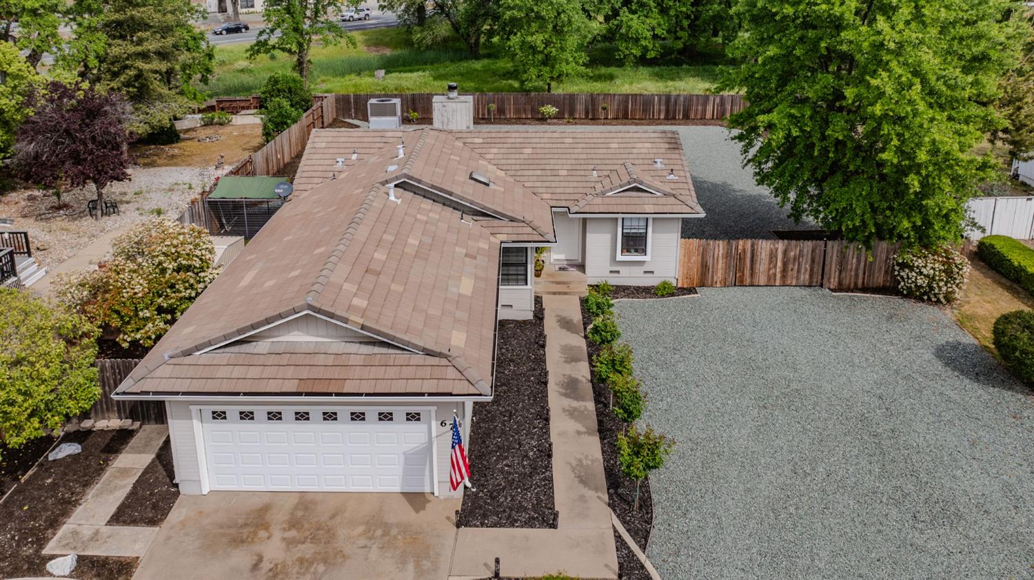 67 St Andrews Road Valley Springs, CA 95252 - Photo 37 of 58 an aerial view of a house with a yard and potted plants