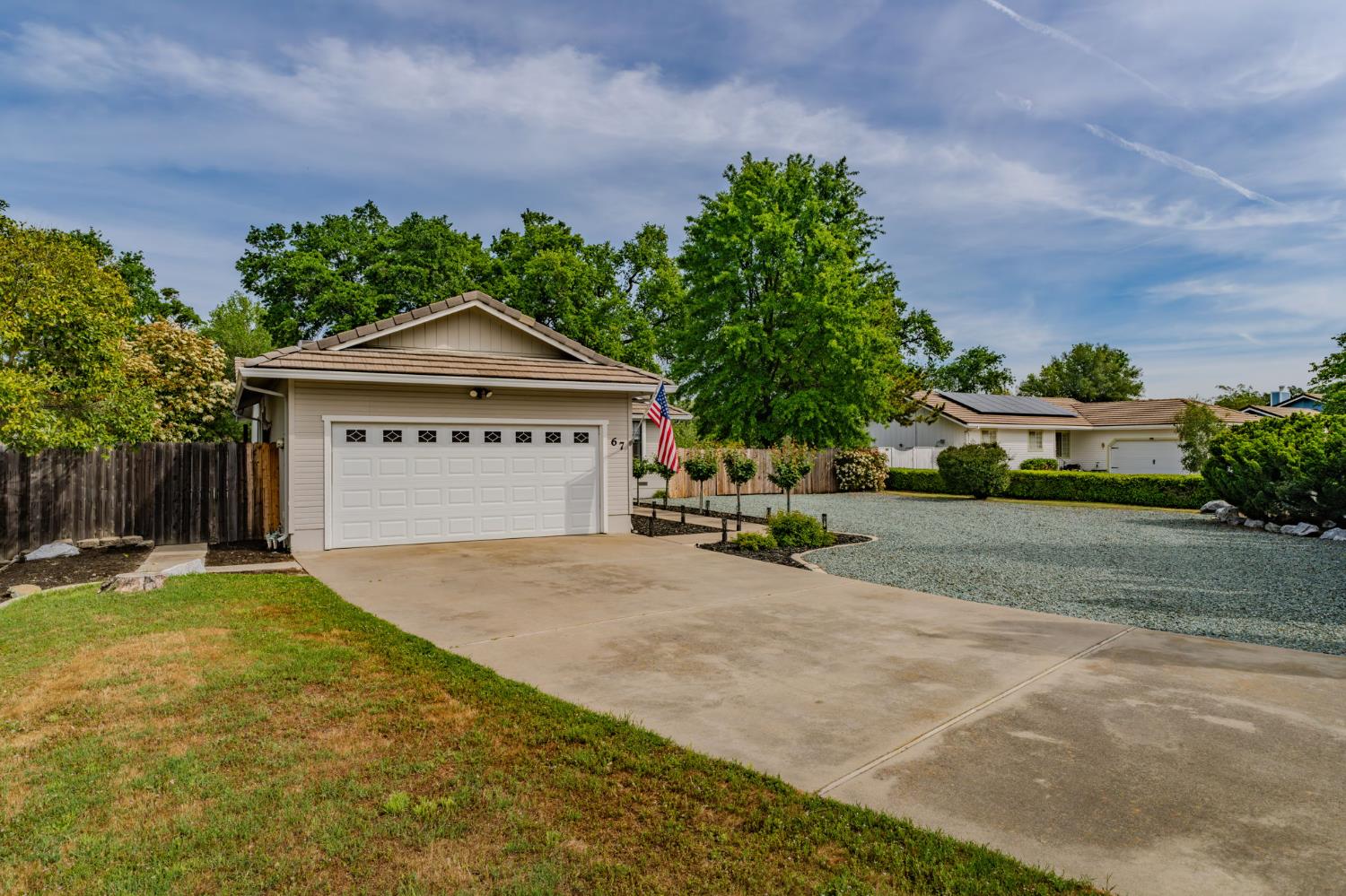 67 St Andrews Road Valley Springs, CA 95252 - Photo 40 of 58 a front view of a house with a yard and garage
