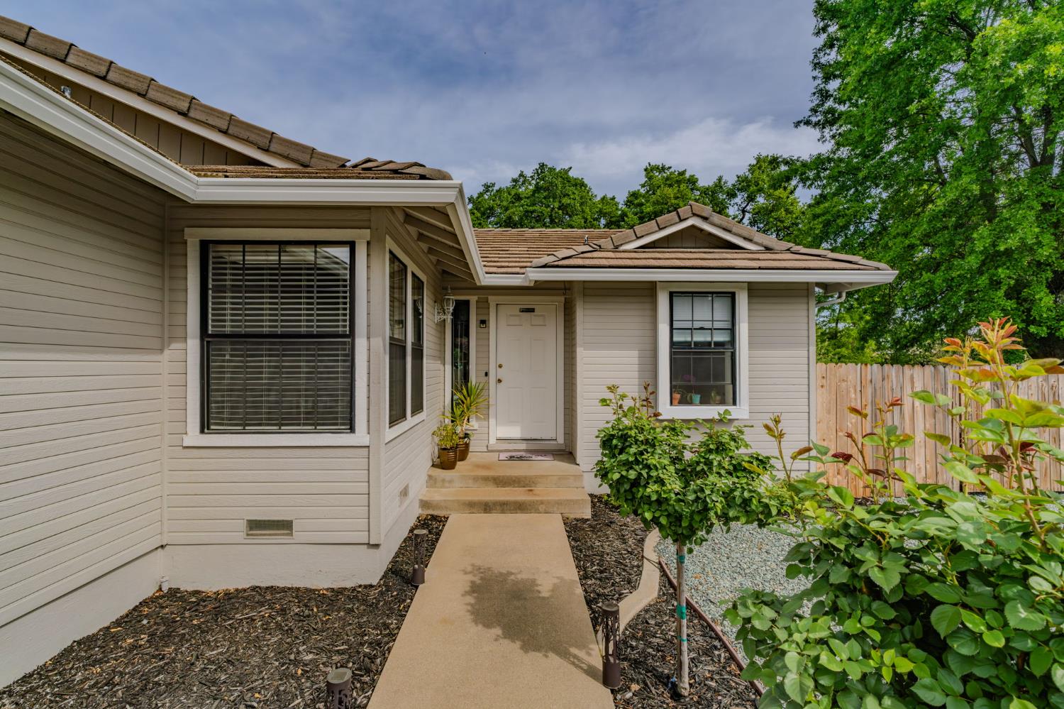 67 St Andrews Road Valley Springs, CA 95252 - Photo 43 of 58 a front view of a house with a garden