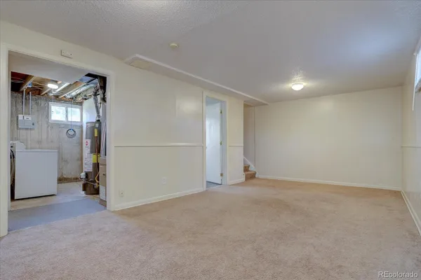 an empty room with a empty space and windows