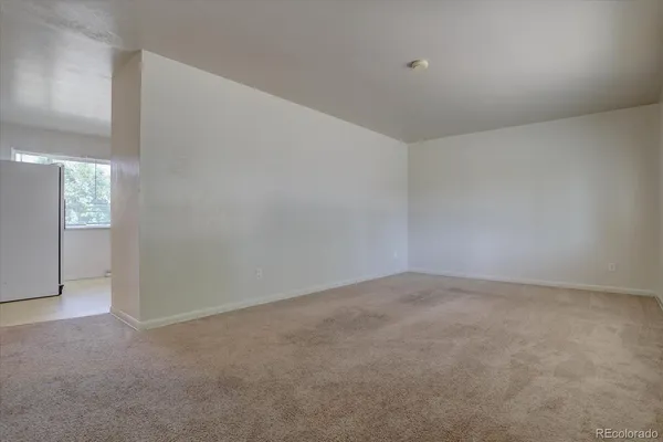 a view of an empty room and window