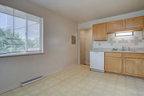 a view of a kitchen with washer and dryer