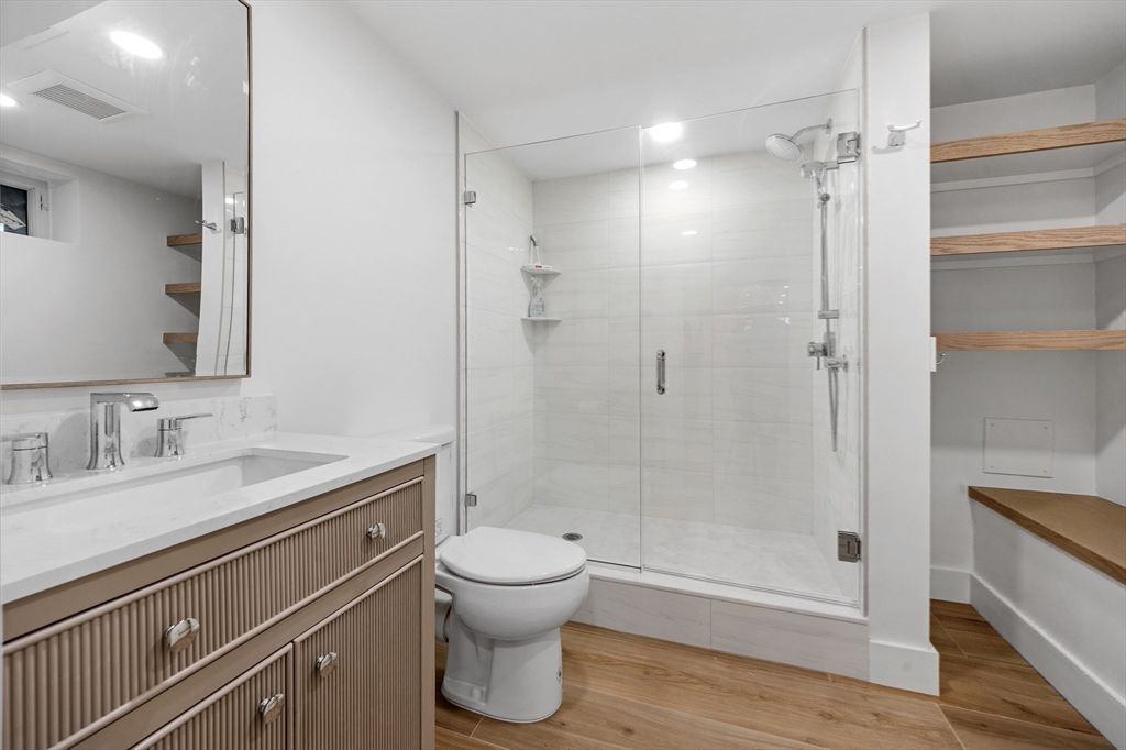12 Daley Road Hingham, MA 02043 - Photo 24 of 32 a bathroom with a granite countertop sink toilet and shower