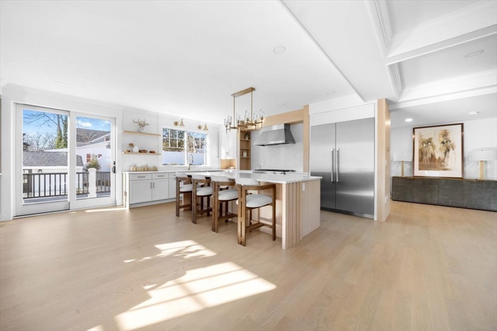12 Daley Road Hingham, MA 02043 - Photo 4 of 32 a view of a kitchen with kitchen island a large window cabinets and stainless steel appliances