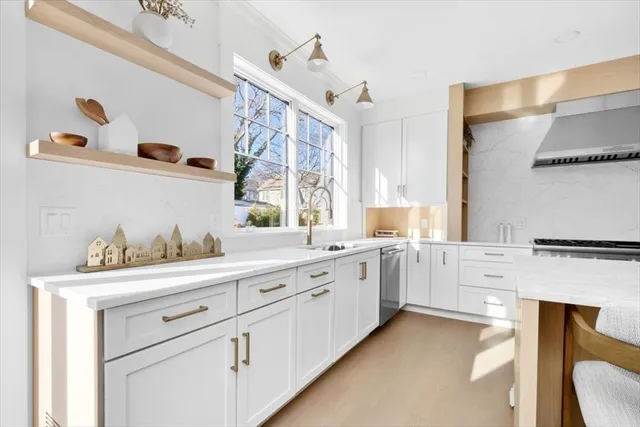 a view of a livingroom with wooden floor and a window