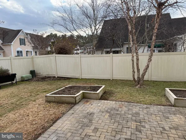 a view of a backyard with chairs
