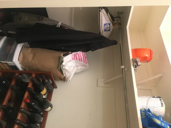 a bedroom with a bed and a lamp