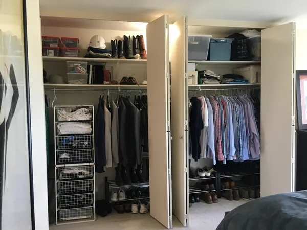 a bathroom with a granite countertop toilet sink and mirror