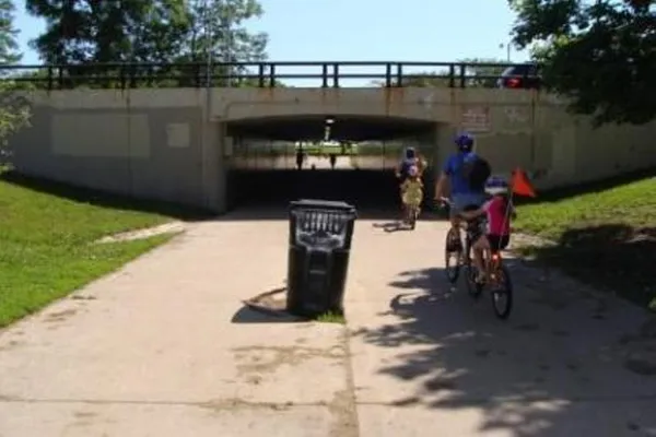 a view of a balcony with floor to ceiling windows and potted plants