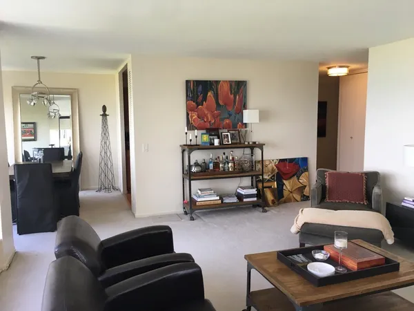 a living room with furniture and a table