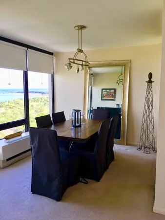 a dining room with furniture and window