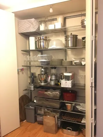 a kitchen with a refrigerator and cabinets
