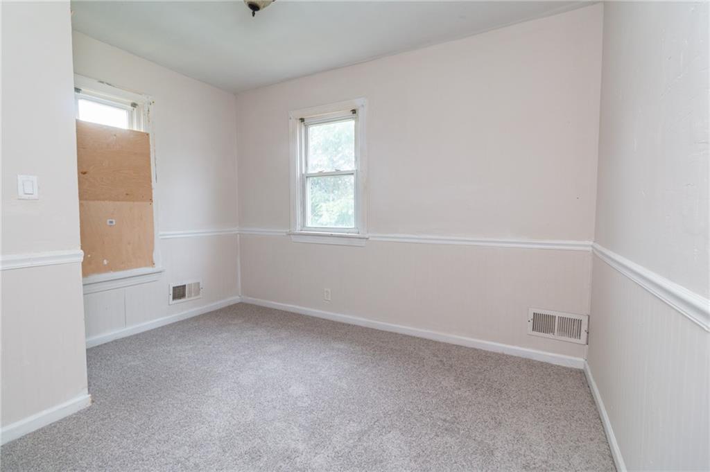 349 Orchard Street Springdale, PA 15144 - Photo 16 of 27 an empty room with windows
