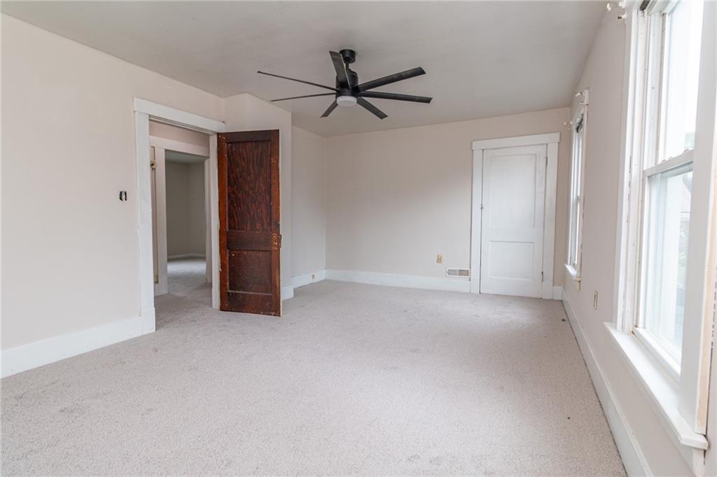 349 Orchard Street Springdale, PA 15144 - Photo 20 of 27 a view of a livingroom with a ceiling fan and window