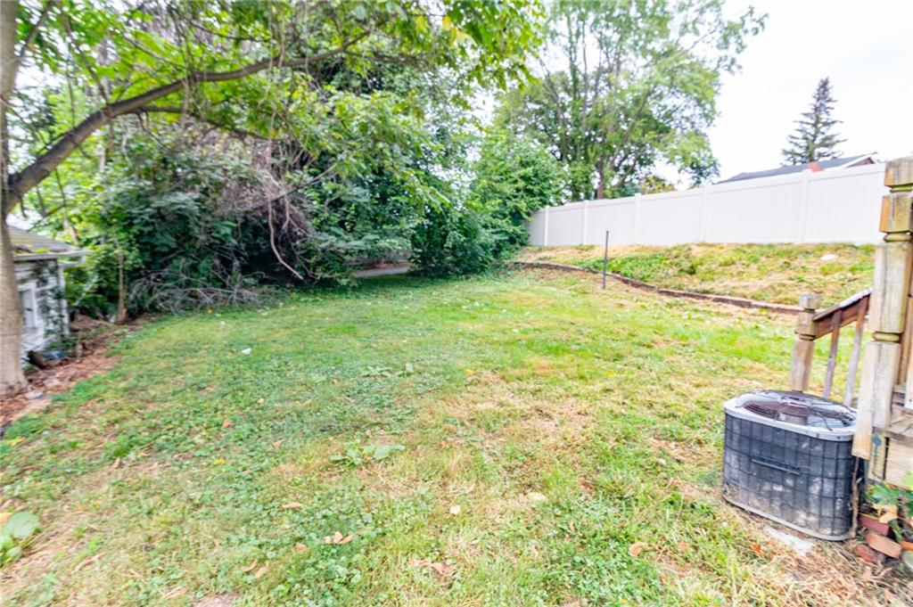 349 Orchard Street Springdale, PA 15144 - Photo 24 of 27 a backyard of a house with table and chairs