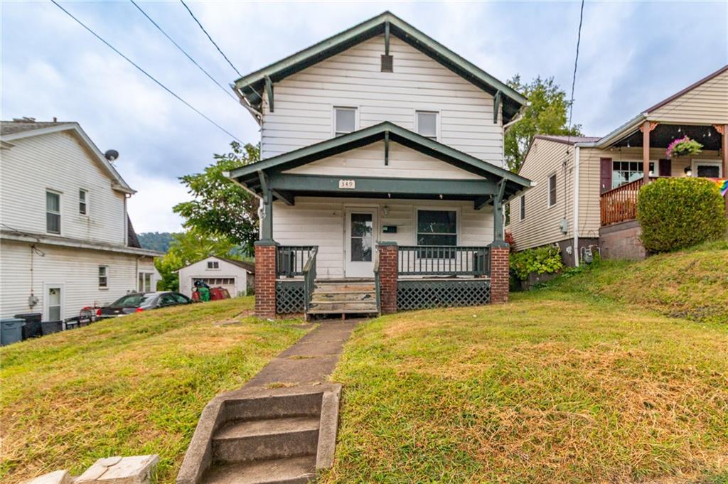 349 Orchard Street Springdale, PA 15144 - Photo 26 of 27 a view of a white house with swimming pool in front of it