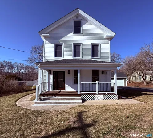 a front view of a house with garage