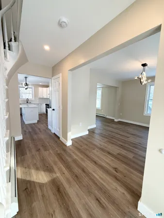 a view of a living room and hardwood floor