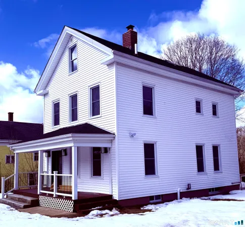 a front view of a house with garage
