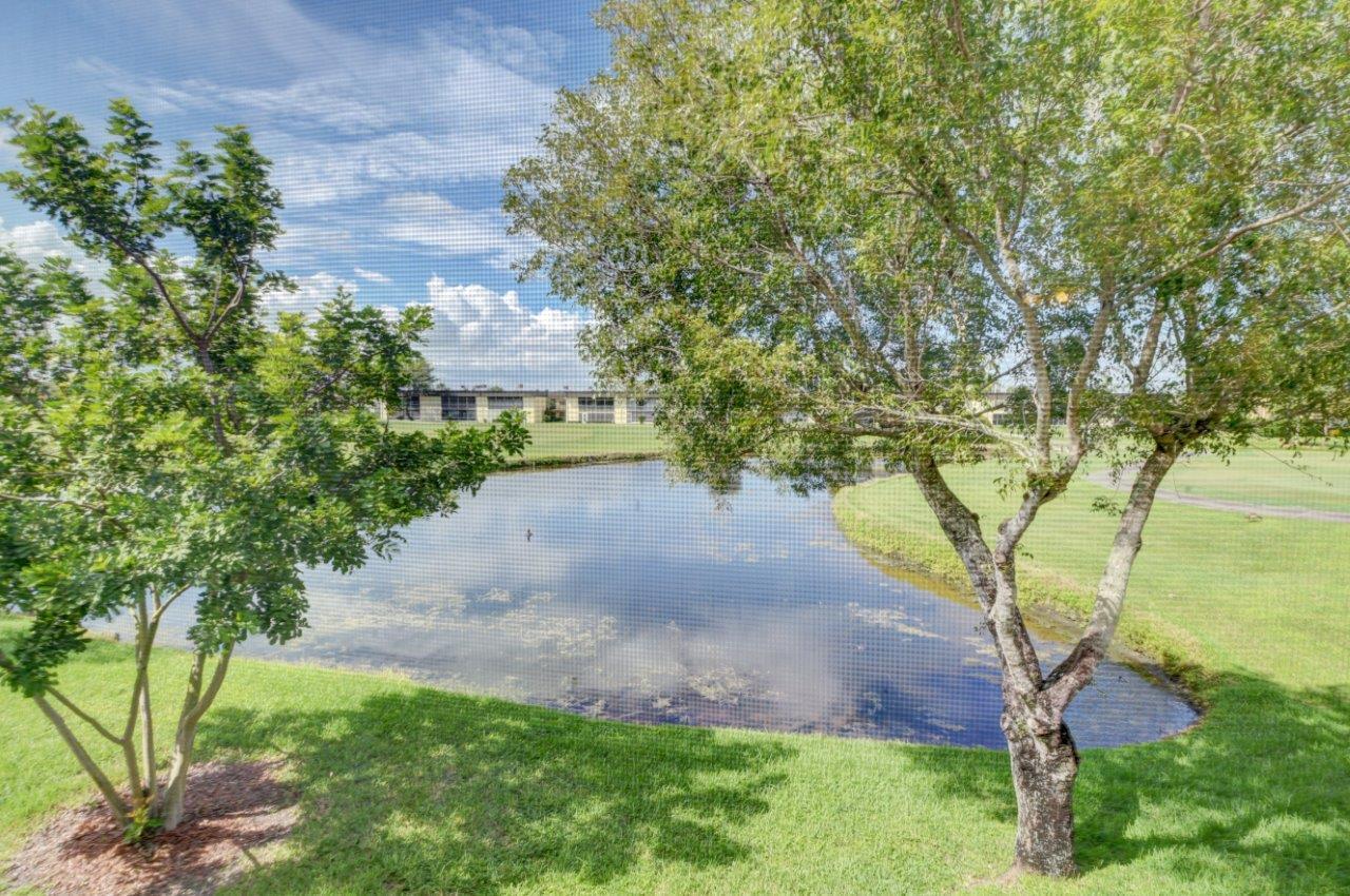 369 Capri H Delray Beach, FL 33484 - Photo 1 of 25 a view of an outdoor space with a lake view