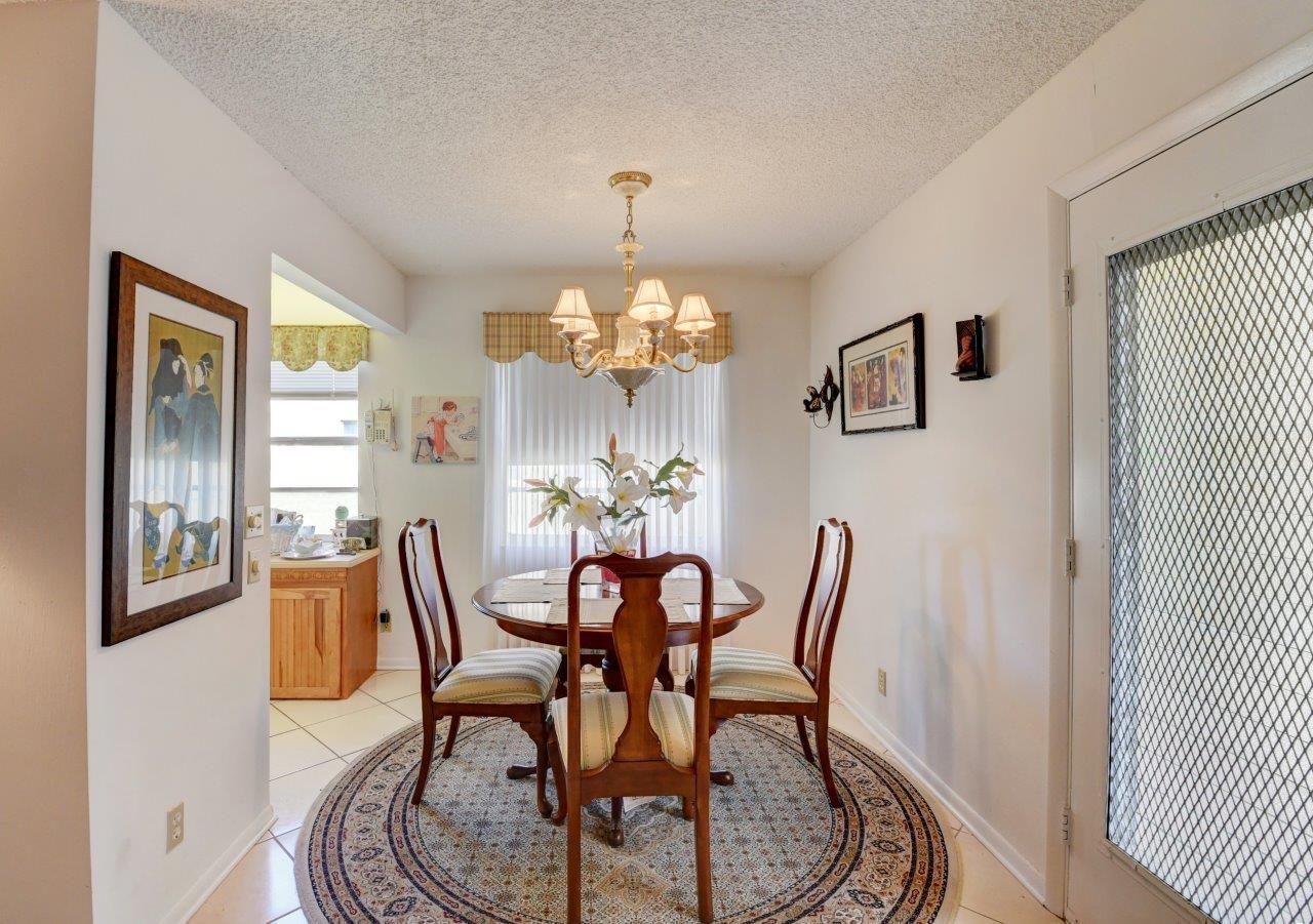 369 Capri H Delray Beach, FL 33484 - Photo 11 of 25 a dining room with furniture and window