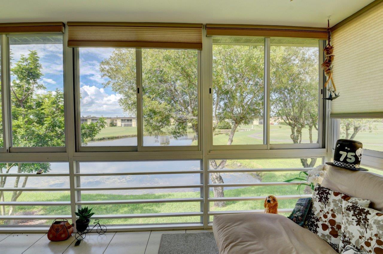 369 Capri H Delray Beach, FL 33484 - Photo 2 of 25 a view of a porch and garden
