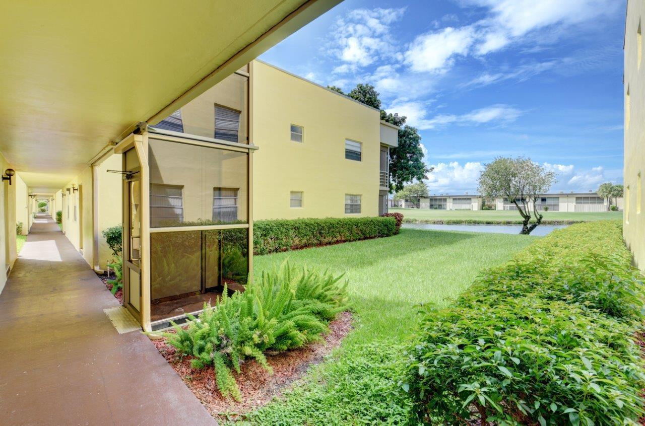 369 Capri H Delray Beach, FL 33484 - Photo 22 of 25 a view of a back yard of the house