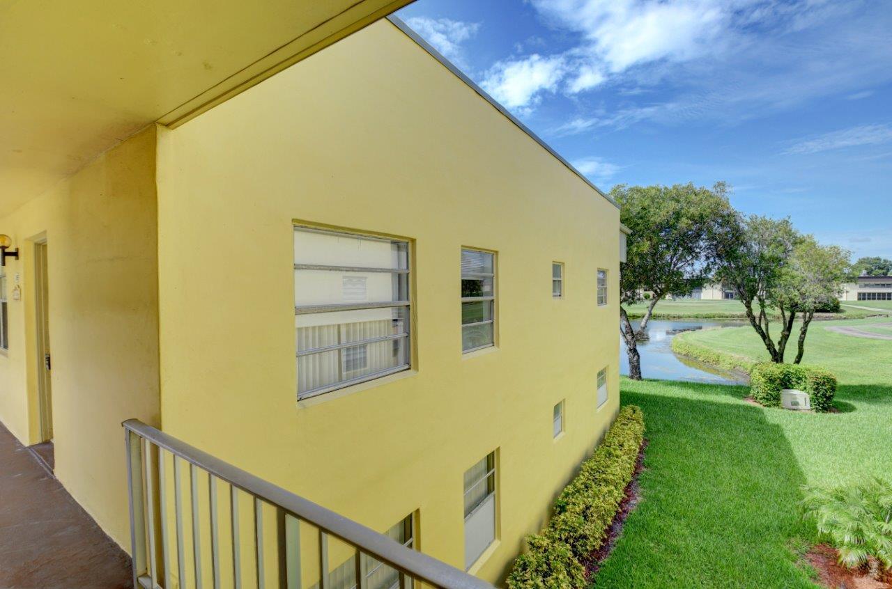 369 Capri H Delray Beach, FL 33484 - Photo 23 of 25 a view of a house with a backyard