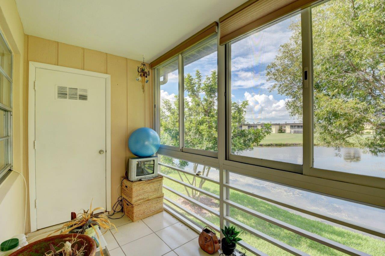 369 Capri H Delray Beach, FL 33484 - Photo 3 of 25 a view of a room that has a large window and furniture