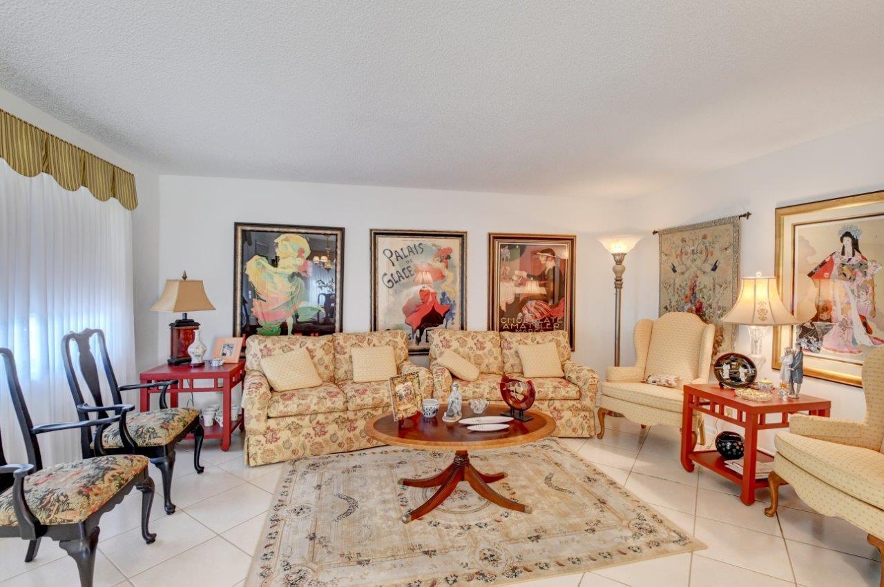 369 Capri H Delray Beach, FL 33484 - Photo 9 of 25 a living room with furniture and a window